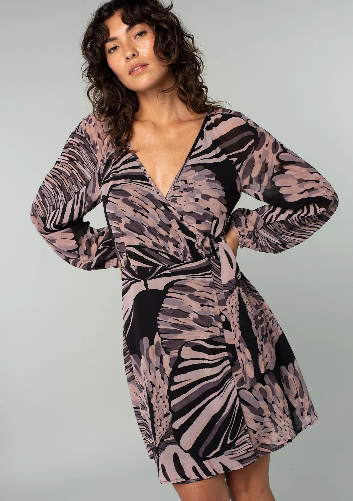 Abstract Long Sleeve O-Ring Mini Wrap Dress
