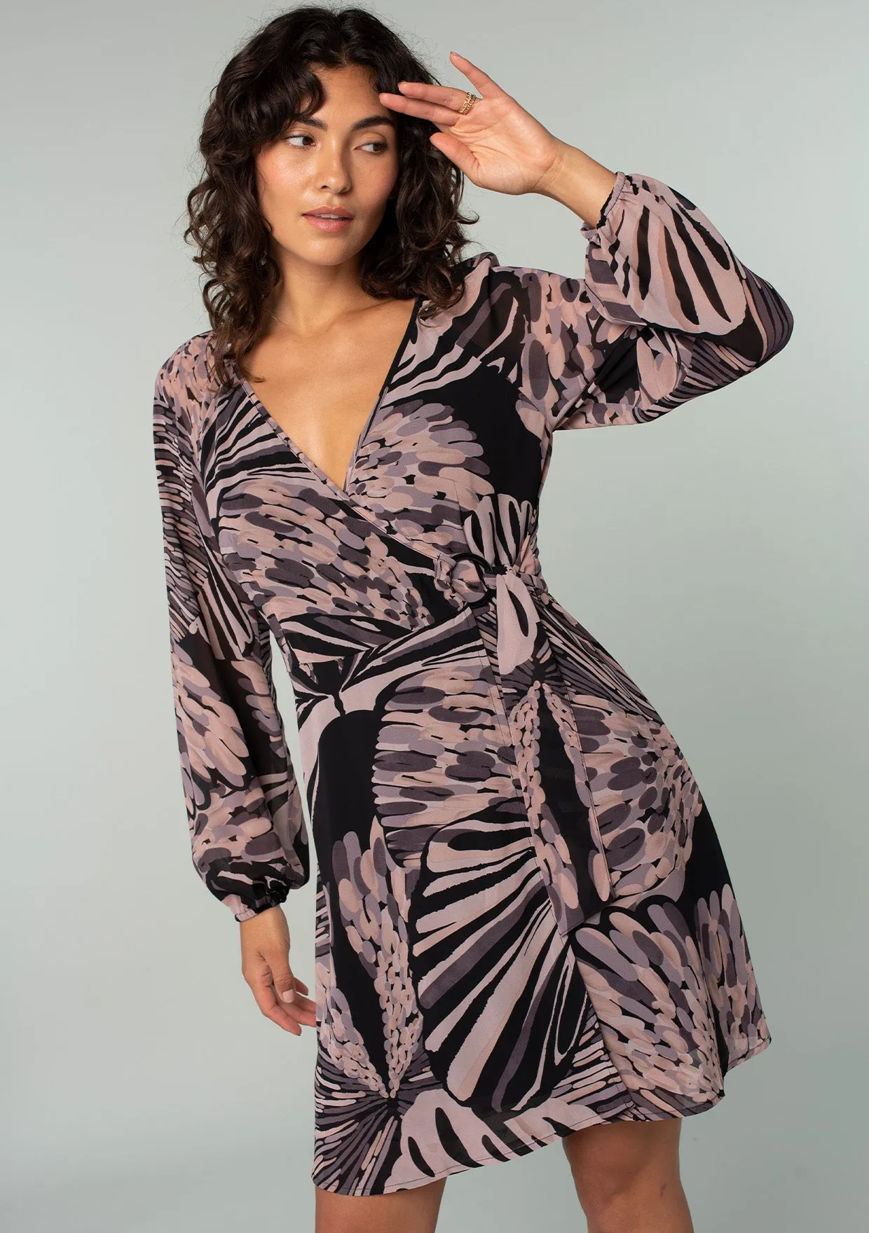 Abstract Long Sleeve O-Ring Mini Wrap Dress